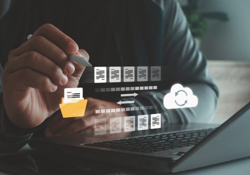 Person using digital pen and laptop with cloud computing icon showing file transfer and data synchronization, online storage, cloud backup, secure digital document management technology. cybersecurity